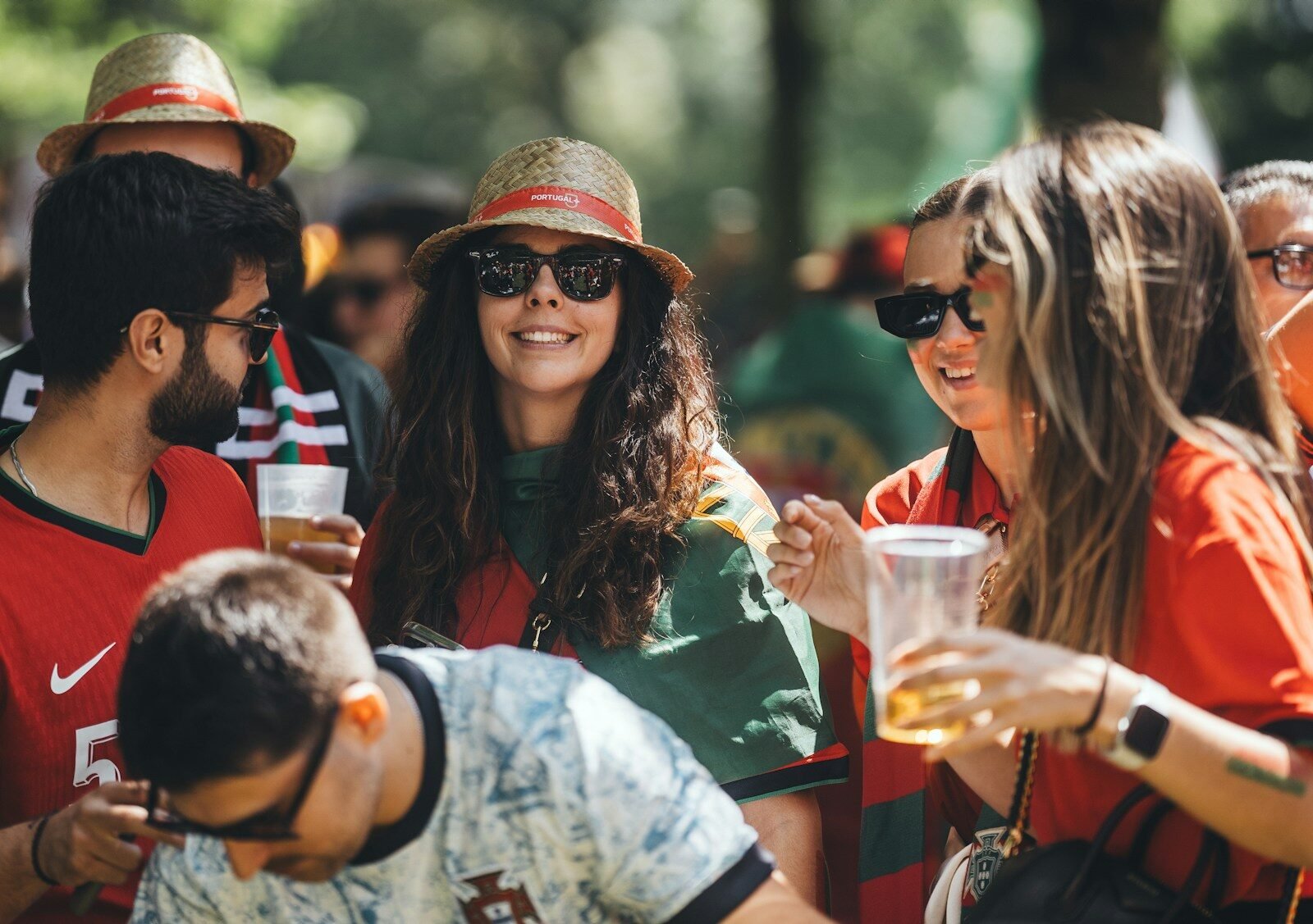 A group of people standing around each other